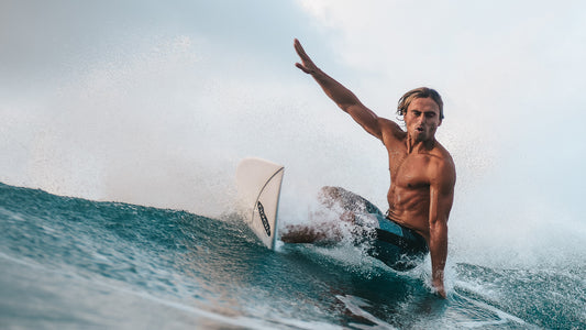 surfer performing a turn on a wave